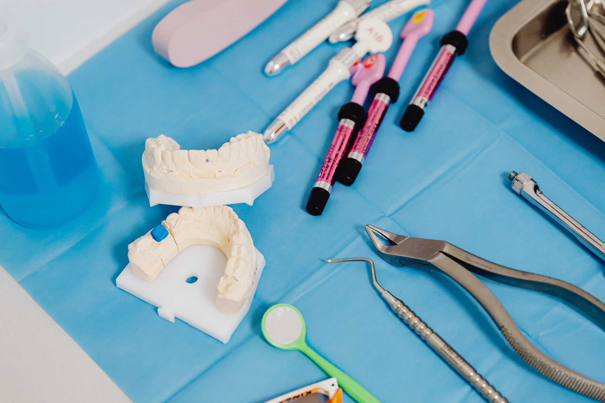 Dental cast and instruments on a clinic worktop