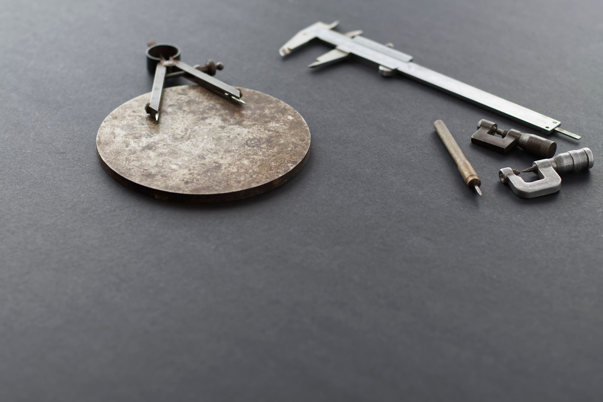 Precision measuring instruments on a workshop surface